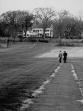 Distant of Mathematicians Albert Einstein and Kurt Godel Taking a Walk