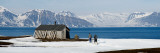 Buy Two Hikers Standing on the Beach Near a Hunting Cabin, Bellsund, Spitsbergen, Svalbard Islands at AllPosters.com