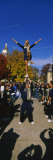 Woman Standing One Leg on a Man Hand and Performing a Stunt, University of Notre Dame