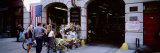 Rear View of Three People Standing in Front of a Memorial at a Fire Station, New York City