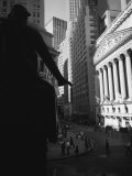 Silhouette of George Washington Statue in Front of a Financial Building