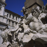 Low Angle View of Statues on a Fountain, Fountain of the Four Rivers, Piazza Navona, Rome, Italy
