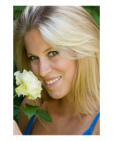 Buy Beautiful Young Blonde Woman With Yellow Rose at AllPosters.com