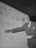 Buy Swiss Architect Le Corbusier Standing on Stage with Notes in His Hand and Drawing on Sketch Pad at AllPosters.com