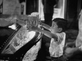 Boy Buying Popcorn at Movie Concession Stand