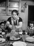 Buy Mother Serving Spaghetti to Her Children at AllPosters.com