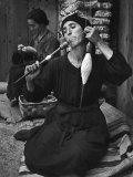 Spanish Peasant Using Ancient Methods to Spin Flax into Thread