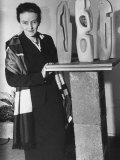 British Sculptor Barbara Hepworth Standing by Piece of Her Sculpture