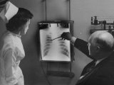 Doctors Examining X-Ray with Nurse