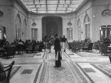 The Bellhop Standing at the Entrance of the Swank Hotel Ritz