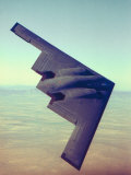Buy B-2 Stealth Bomber Flying over Desert-Like Landscape at AllPosters.com