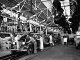 Buy Men and Women Polishing Chevrolets on the Assembly Line at the General Motors Plant at AllPosters.com