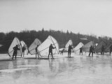 People Ice Skate Sailing on a Lake