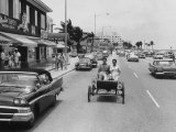 Buy Riding in Reproduction of 1901 Oldsmobile in Beach Front Street at AllPosters.com