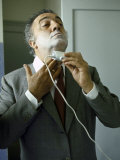Buy Director Federico Fellini with Powder on His Face as He Shaves with an Electric Shaver at AllPosters.com