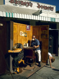 Artist Ed Kienholz Drinking Coffee Inside Section of His Assemblage 