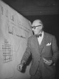 Buy Swiss Architect Le Corbusier Standing on Stage with Notes in His Hand and Drawing on Sketch Pad at AllPosters.com