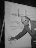 Buy Swiss Architect Le Corbusier Standing on Stage with Notes in His Hand and Drawing on Sketch Pad at AllPosters.com