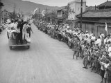 Buy Fire Engine Bearing Flags and Leading Occupying Troops and Reporters into Town at AllPosters.com