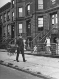 Buy Children Watching a Policeman Walk His Beat in Front of Apartment Buildings at AllPosters.com