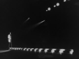 Singer Pat Boone Singing into Mike in Front of the Footlights on Stage in Auditorium