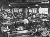 Men and Women Working in Clothing Factory