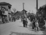 People Working and Living in Busy Section of City