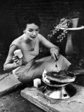 Buy Well-Dressed Woman Cooking a Large Steak on the Aluminum Disposable Barbecue Grill at AllPosters.com