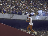 The Torch Being Carried Up the Steps in the Olympic Stadium at the Summer Olympics