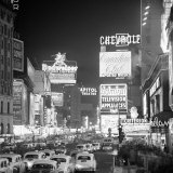 Buy Brightly Lit Signs Shining over Traffic Going Down Broadway Towards Times Square at AllPosters.com