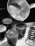 Buy Melted Paraffin Being Poured onto Jars to Seal in Canned Goods at AllPosters.com