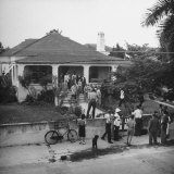 Jurors and Lawyers Standing on the Porch and Lawn of Alfred Marigny