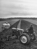 Buy French Farmer Georges Raoul Fremond Trying Out His New Massey-Harris Tractor Obtained Through Eca at AllPosters.com