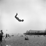 Man Flying Off a Trampoline at Santa Monica Beach