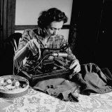 Mrs. Milton D. Phillips Sewing Clothes for Her Family to Stretch the Budget