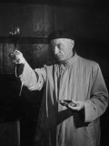 Man Examining the Clearness of the Wine and Decides it Will Be a Good Year