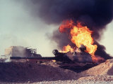 Buy Iraqi Tank Burning While US Army Convoy Drives Past into Iraq During Gulf War at AllPosters.com