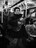 Folk Singer Woody Guthrie Singing Aboard a Subway Train