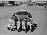 Men Pushing Car During Nat. Hot Rod Assoc. Drag Meet