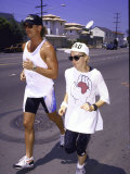 Singer Madonna Jogging with Trainer