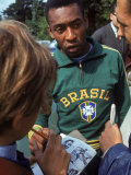 Buy Soccer Star Pele Signing Autographs for Fans During a Practice Prior to World Cup Competition at AllPosters.com