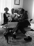 Buy Actor Paul Newman and His Wife Joanne Woodward W. Unident. Guest During an Informal Party at AllPosters.com