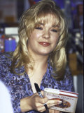 Buy Country Singer Leann Rimes Holding Her Book Holiday in Your Heart at Walden Books at AllPosters.com