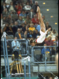 Soviet Gymnast Olga Korbut in Action on the Uneven Bars at the Summer Olympics