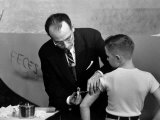 Dr. Jonas Salk Inoculating a Young Boy W. His New Polio Vaccine