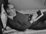 Buy Author Vladimir Nabokov Writing in a Notebook on the Bed at AllPosters.com