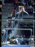 Soviet Gymnast Olga Korbut in Action on the Uneven Bars at the Summer Olympics