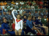 Soviet Gymnast Olga Korbut Holding Up Flowers at the Summer Olympics