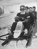 Joseph Meconi Sitting in Driver's Seat of Bobsled with Teammates at Winter Olympics