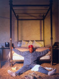 Entertainment Mogul Russell Simmons Relaxing on Bedroom Floor at Foot of Four-Poster Bed